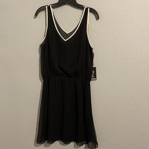 New Express black dress with white neckline trim in a size Large.